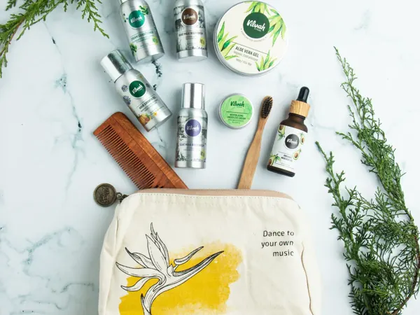 Personal care essentials arranged with a canvas bag